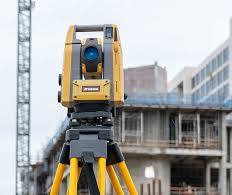Robotic total stations measure distances and angles for a ...